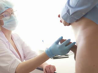 Busty Doctor milking the prostate. Stuck her finger up the ass