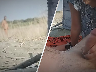 My wife jerks my dick alongside front of a stranger alongside nudist beach