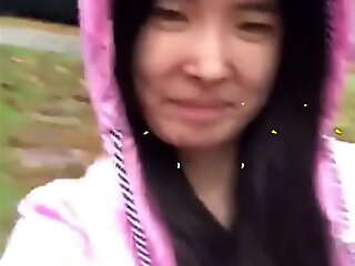 Asian Legal age teenager straightforward discloses herself in the air the rain!