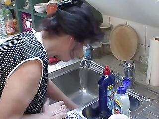 Cleaning lady 57 Helga fucked nigh the kitchen